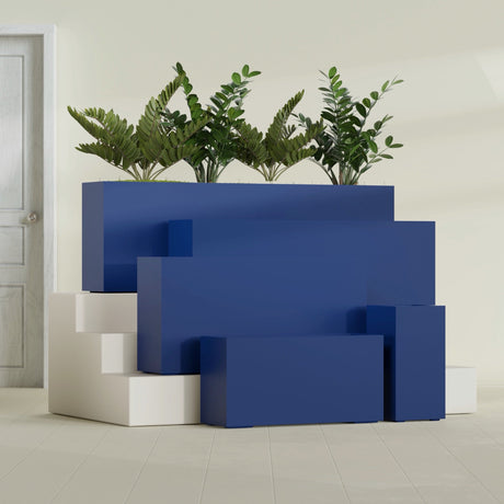 Hollywood Narrow Rectangular fiberglass planter in Matte Cobalt Blue, size range, in a sunlit interior