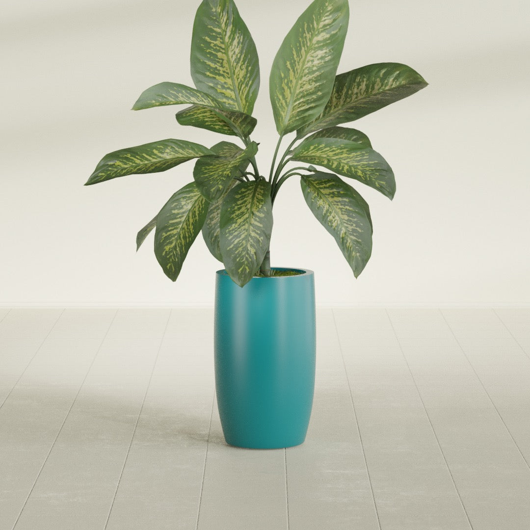 Lisbon Tall Round fiberglass planter in Satin Seafoam Green, shown planted, in a sunlit interior