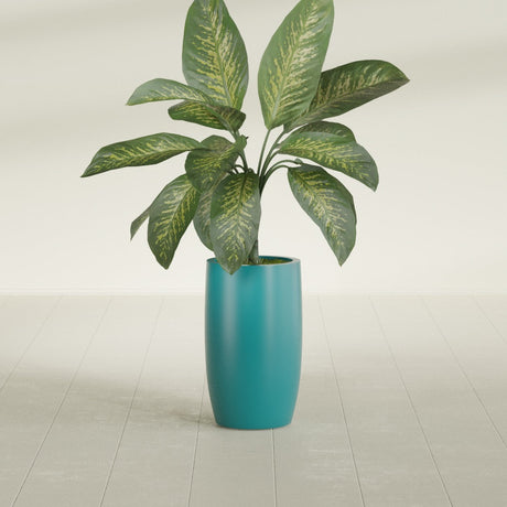 Lisbon Tall Round fiberglass planter in Satin Seafoam Green, shown planted, in a sunlit interior
