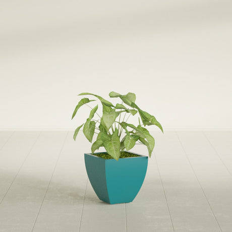 Lima Tapered Square fiberglass planter in Satin Seafoam Green, shown planted, in a sunlit interior