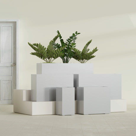 Potsdam Corner fiberglass planter in Metallic Silver, size range, in a sunlit interior