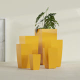 Toulan Tapered Square fiberglass planter in Gloss Saffron, size range, in a sunlit interior