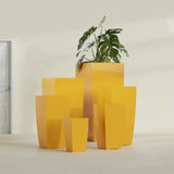 Toulan Tapered Square fiberglass planter in Gloss Saffron, size range, in a sunlit interior