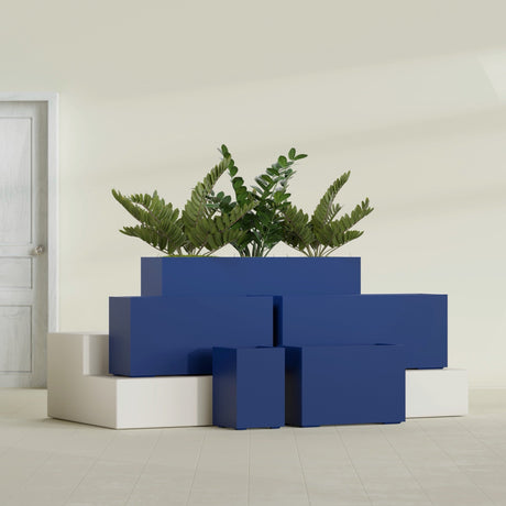 Tolga Rectangular fiberglass planter in Matte Cobalt Blue, size range, in a sunlit interior