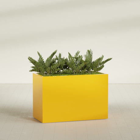 Brisbane Rectangular fiberglass planter in Gloss Saffron, planted, in a sunlit interior