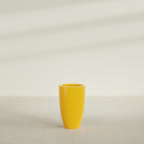 Brannan Tapered Round Planter in Gloss Saffron, 18"D × 29"H, shown empty