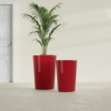 Tegel Round Tapered fiberglass planter in Gloss Red, size range, in a sunlit interior