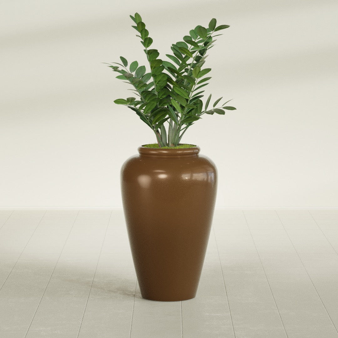 Barà Jar fiberglass planter in Metallic Bronze, shown planted, in a sunlit interior