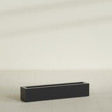 Salon Box Planter in Matte Black, 42" Long, shown empty