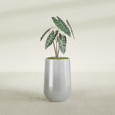 Hayden Urn fiberglass planter in Metallic Silver, shown planted, in a sunlit interior