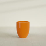 Valencia Tapered Round Planter in Gloss Tangerine, 20"D × 23"H, shown empty