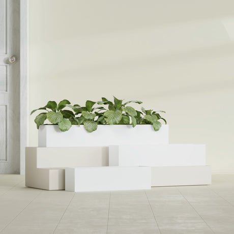 Monaco Rectangle fiberglass planter in Matte Bright White, shown planted, in a sunlit interior