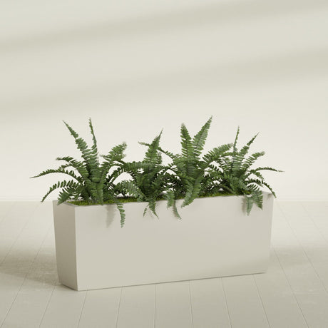 Panama Tapered fiberglass planter in Satin Beige, planted, in a sunlit interior