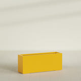 Tolga Rectangular Planter in Gloss Saffron, 60"L × 16"D × 24"H, shown empty