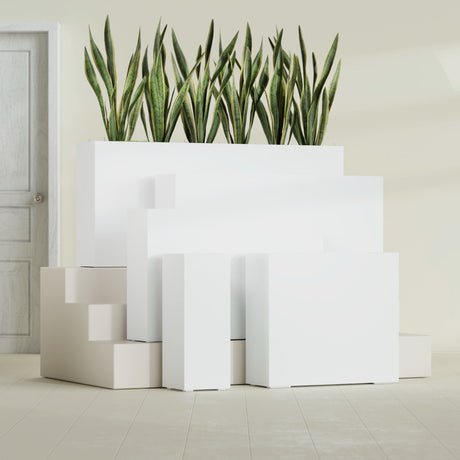 Delray Corner fiberglass planter in Matte Bright White, size range, in a sunlit interior