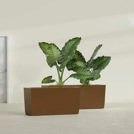 Panama Tapered Rectangular fiberglass planter in Metallic Bronze, shown planted, in a sunlit interior