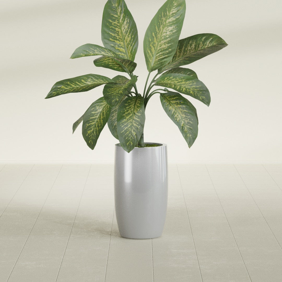 Lisbon Tall Round fiberglass planter in Metallic Silver, shown planted, in a sunlit interior