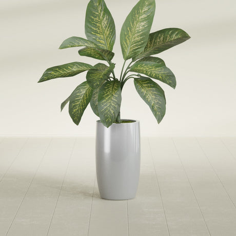 Lisbon Tall Round fiberglass planter in Metallic Silver, shown planted, in a sunlit interior