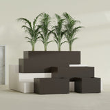Torino Wide Rectangular fiberglass planter in Matte Dark Brown, size range, in a sunlit interior