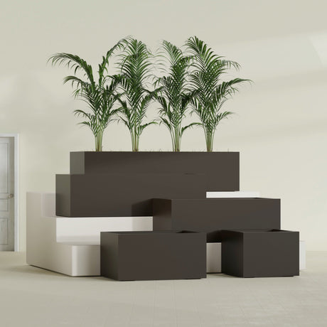 Torino Corner fiberglass planter in Matte Dark Brown, size range, in a sunlit interior