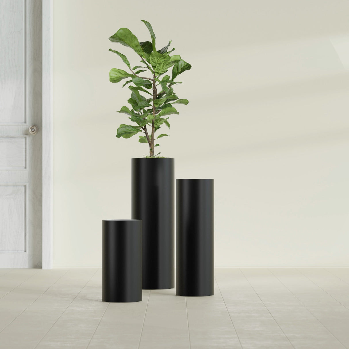 Corry Cylinder fiberglass planter in Matte Black, size range, in a sunlit interior