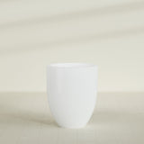 Valencia Tapered Round Planter in Matte Bright White, 27"D × 31"H, shown empty
