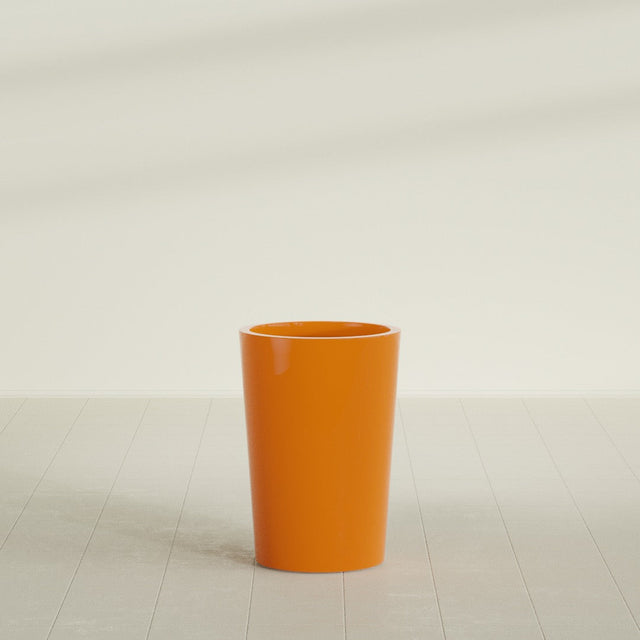 Tegel Round Tapered Planter in Gloss Tangerine, 18"D × 26"H, shown empty