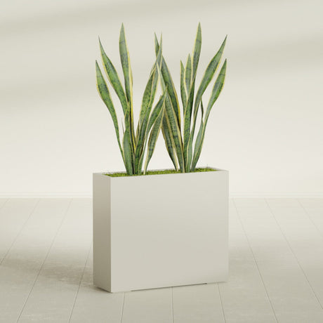 Perth Corner fiberglass planter in Satin Beige, shown planted, in a sunlit interior