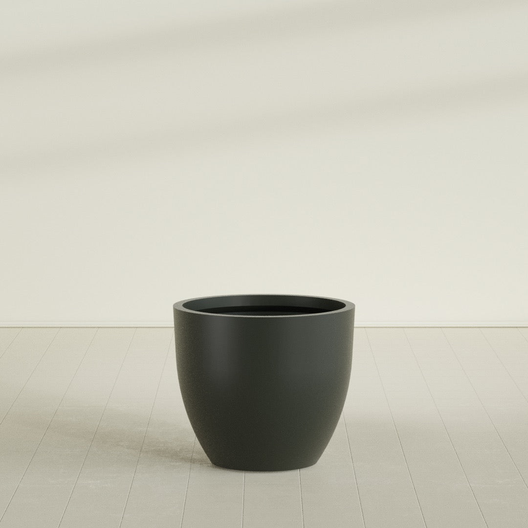 Wannsee Round Planter in Matte Charcoal, 39"D × 34"H, shown empty