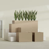 Granada fiberglass planter in Gloss Metallic Gold, size range, in a sunlit interior
