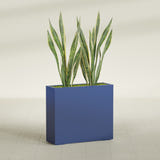 Perth Corner fiberglass planter in Matte Cobalt Blue, shown planted, in a sunlit interior