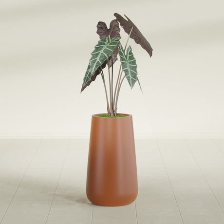 Saigon Tapered Round fiberglass planter in Matte Terra Cotta, shown planted, in a sunlit interior