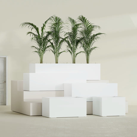 Torino Corner fiberglass planter in Gloss Bright White, size range, in a sunlit interior