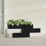 Monaco Rectangle fiberglass planter in Matte Black, shown planted, in a sunlit interior