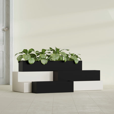 Monaco Rectangle fiberglass planter in Matte Black, shown planted, in a sunlit interior