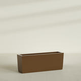 Panama Tapered Rectangular Planter in Metallic Bronze, 48"L × 12"D × 18"H, shown empty