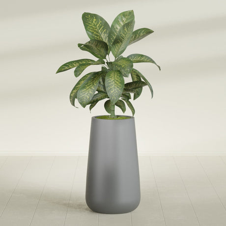 Saigon Tall Round Tapered fiberglass planter in Matte Gunmetal, planted, in a sunlit interior