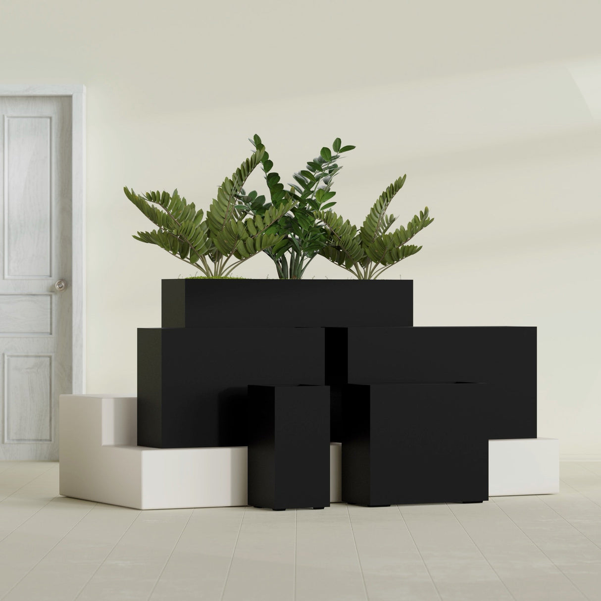 Potsdam Corner fiberglass planter in Matte Black, size range, in a sunlit interior