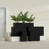 Potsdam Corner fiberglass planter in Matte Black, size range, in a sunlit interior
