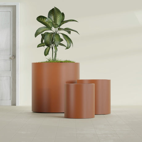 Rio Grande Cylinder fiberglass planter in Matte Terra Cotta, size range, in a sunlit interior