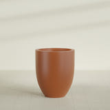 Valencia Tapered Round Planter in Matte Terra Cotta, 27"D × 31"H, shown empty
