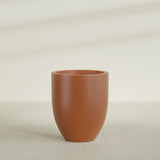 Valencia Tapered Round Planter in Matte Terra Cotta, 27"D × 31"H, shown empty