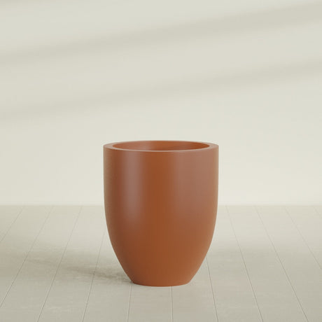 Valencia Tapered Round Planter in Matte Terra Cotta, 27"D × 31"H, shown empty