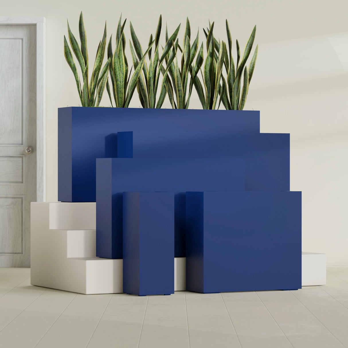 Delray Corner fiberglass planter in Matte Cobalt Blue, size range, in a sunlit interior