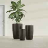 Lisbon Tall Round fiberglass planter in Matte Dark Brown, size range, in a sunlit interior