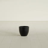 Wannsee Round Planter in Matte Black, 15"D × 13"H, shown empty