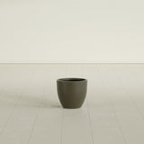Wannsee Round Planter in Matte Bronze, 15"D × 13"H, shown empty