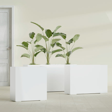 Milano Narrow Rectangular fiberglass planter in Matte Bright White, shown planted, in a sunlit interior