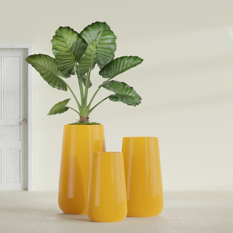 Saigon Tapered Round fiberglass planter in Gloss Saffron, size range, in a sunlit interior