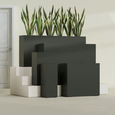 Delray Corner fiberglass planter in Matte Charcoal, size range, in a sunlit interior